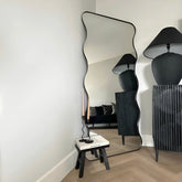 Wavy black frame mirror